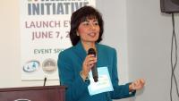 Dr. Ginny Mantello speaking at an event, at podium.